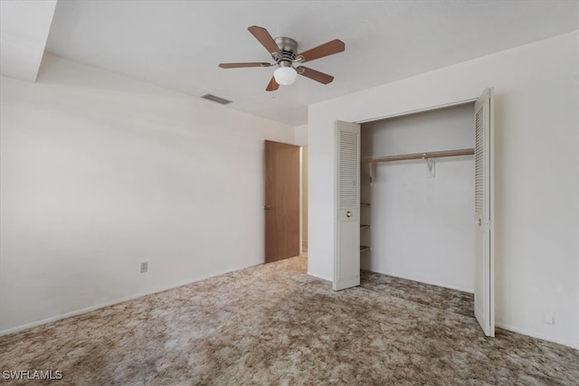 unfurnished bedroom featuring carpet flooring, ceiling fan, and a closet