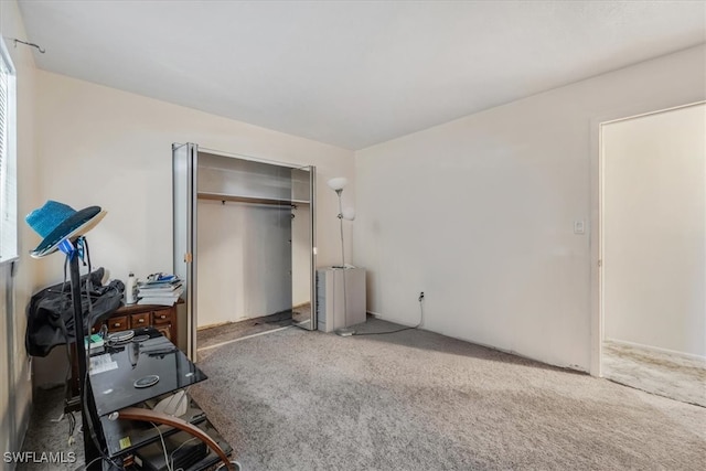 carpeted bedroom featuring a closet