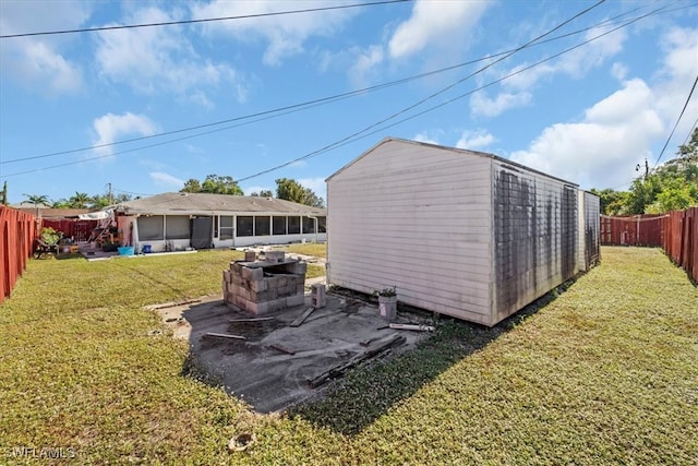 exterior space featuring a yard and a sunroom