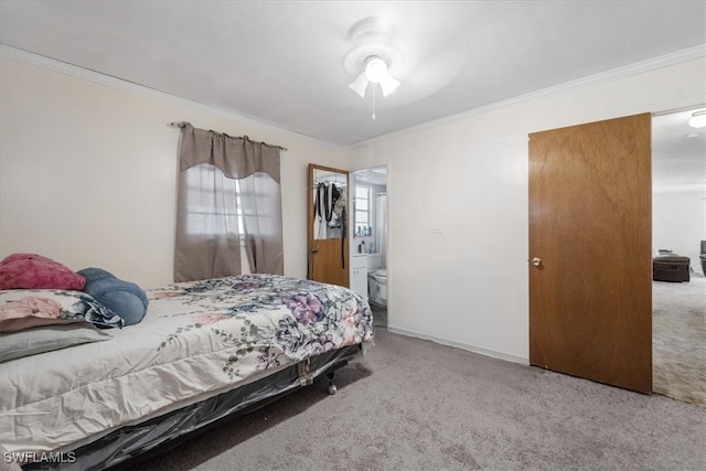 bedroom featuring carpet flooring, ceiling fan, crown molding, and ensuite bathroom