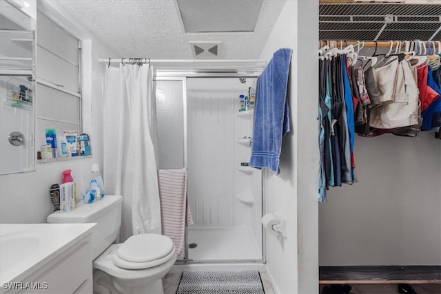 bathroom with a shower with curtain, vanity, and toilet