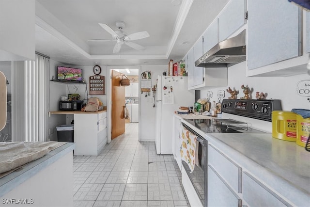 kitchen with a raised ceiling, range hood, white refrigerator, stainless steel electric stove, and white cabinets