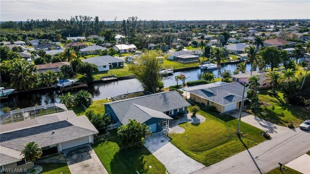 aerial view with a water view and a residential view