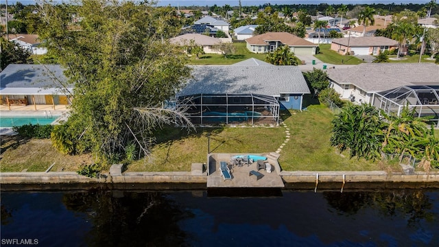 aerial view featuring a residential view and a water view