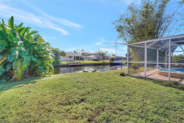 view of yard with a water view, a lanai, and an outdoor pool