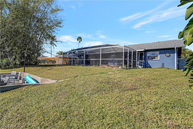 view of yard with a lanai