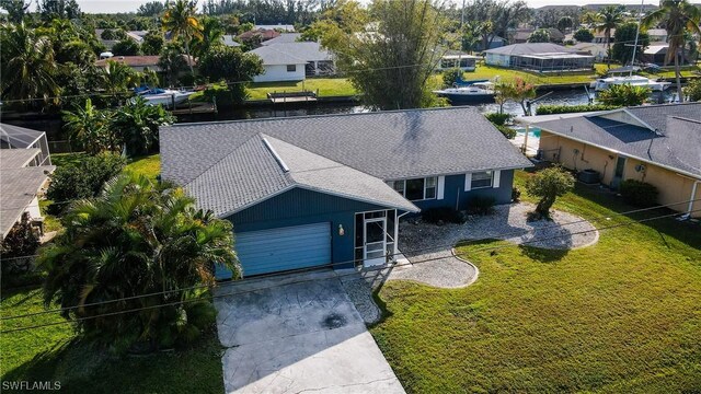 birds eye view of property with a residential view