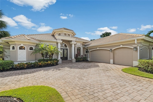 mediterranean / spanish-style home featuring a garage