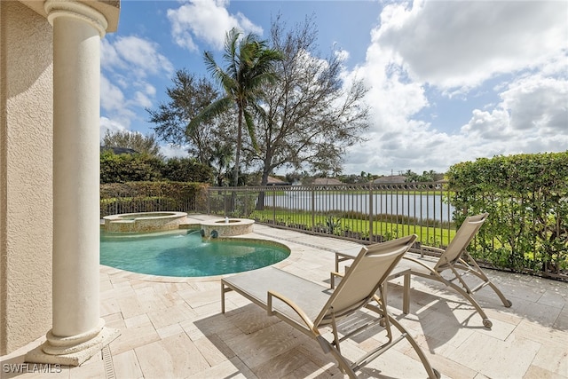 view of swimming pool with a patio area, an in ground hot tub, pool water feature, and a water view