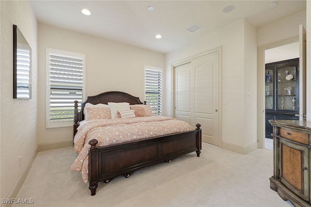 carpeted bedroom featuring a closet