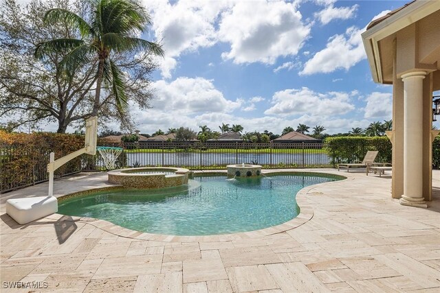 view of swimming pool featuring an in ground hot tub, a patio area, and a water view