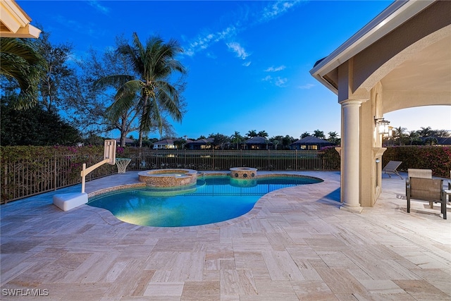 view of pool with an in ground hot tub and a patio area