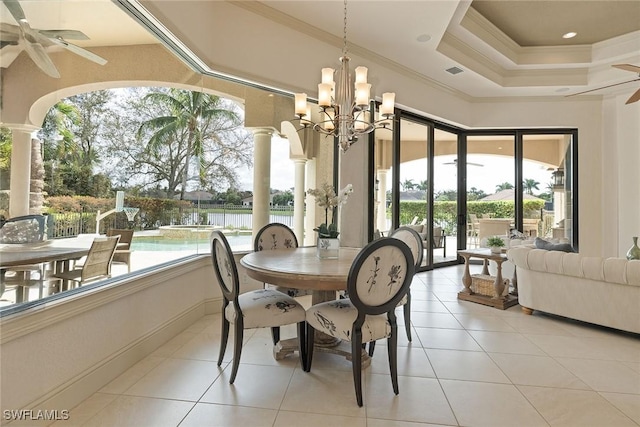 16540 Cellini Ln, Naples, FL 34110 - dining area featuring ornamental molding, ceiling fan with notable chandelier, and a wealth of natural light