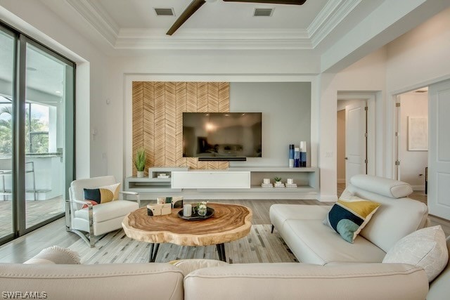 living room featuring ornamental molding and hardwood / wood-style flooring