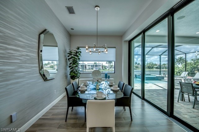 dining room featuring a chandelier and hardwood / wood-style floors