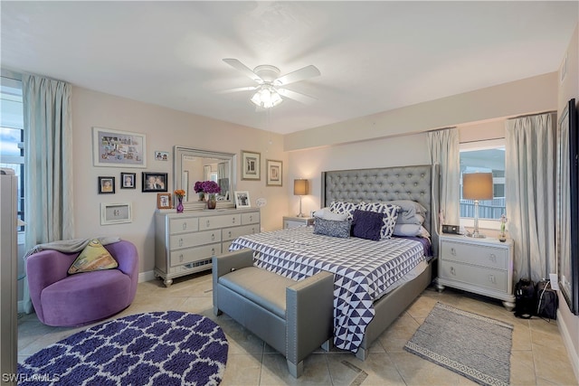 bedroom featuring ceiling fan and light tile floors