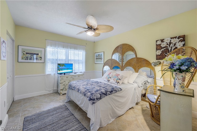 bedroom featuring light tile flooring and ceiling fan