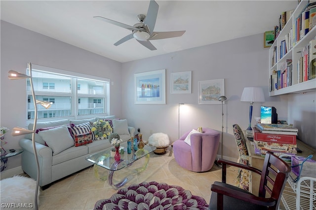 tiled living room with a healthy amount of sunlight and ceiling fan