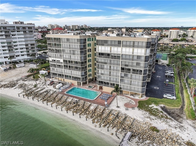 birds eye view of property featuring a beach view