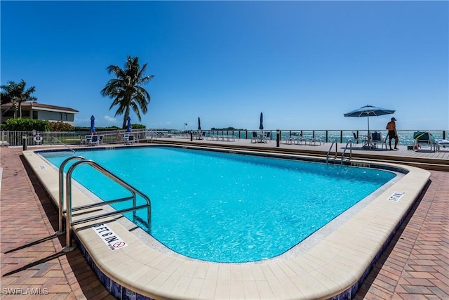 view of swimming pool with a patio area