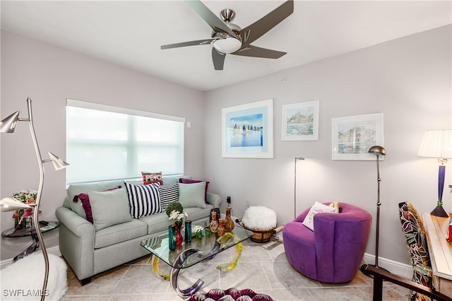 living room with ceiling fan and light tile patterned flooring