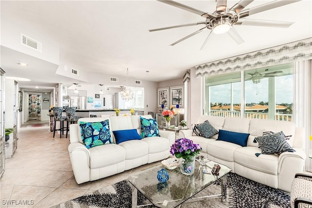 tiled living room featuring ceiling fan