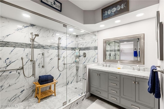 bathroom featuring vanity and a shower with door