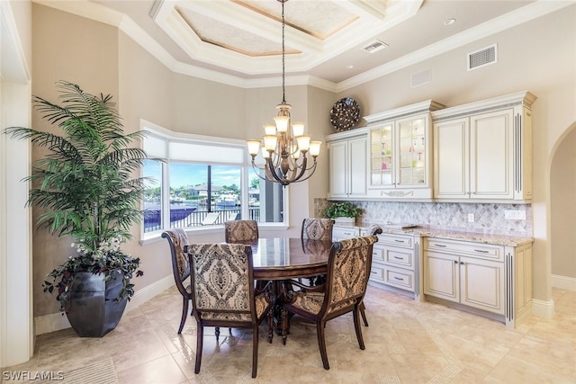 dining space with ornamental molding, a high ceiling, a notable chandelier, coffered ceiling, and light tile floors