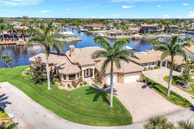 birds eye view of property with a water view