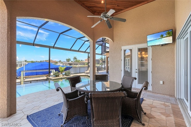 sunroom with wooden ceiling and ceiling fan