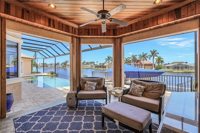 view of patio / terrace featuring ceiling fan, outdoor lounge area, a pergola, and a water view