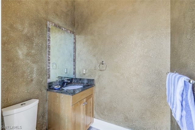 bathroom with oversized vanity and toilet