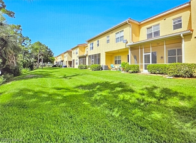 view of yard featuring central AC