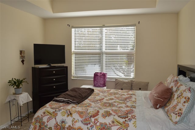 bedroom featuring multiple windows