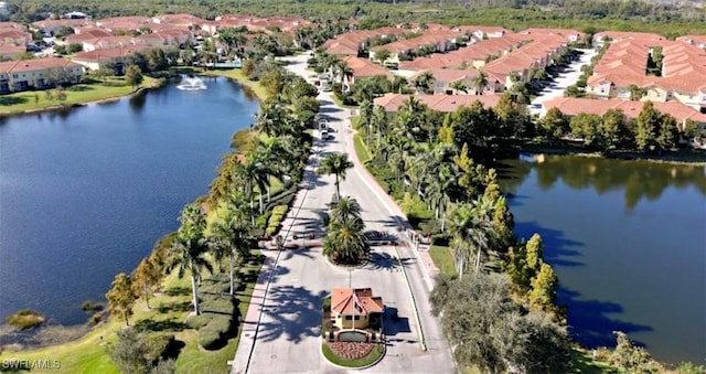 bird's eye view with a residential view and a water view