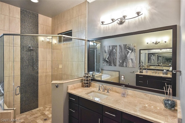 bathroom with an enclosed shower and vanity