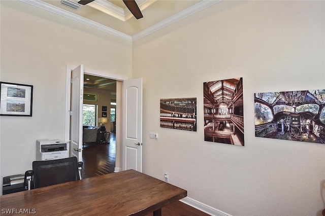 office space featuring dark hardwood / wood-style floors, ornamental molding, and ceiling fan