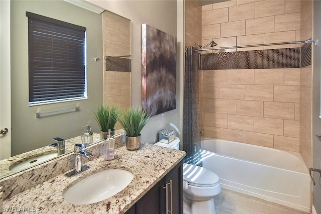 full bathroom featuring tile floors, tiled shower / bath combo, toilet, and vanity