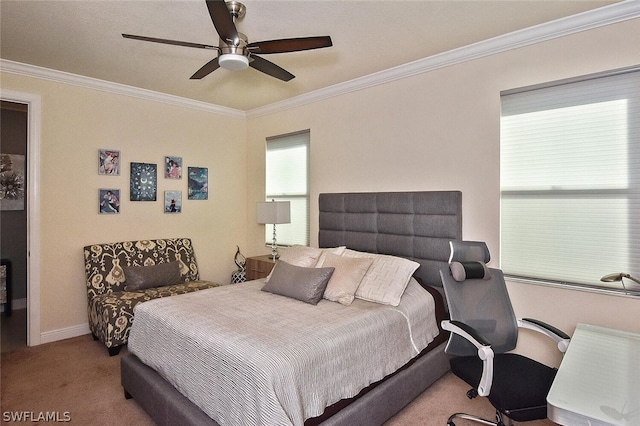 bedroom featuring carpet floors, ornamental molding, and ceiling fan