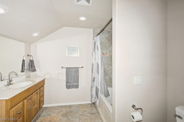 full bathroom featuring lofted ceiling, toilet, shower / bath combination with curtain, and vanity