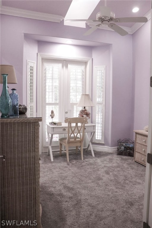 dining space with carpet floors, ceiling fan, and crown molding