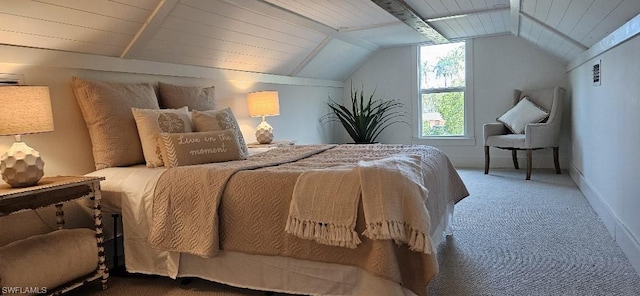 carpeted bedroom with vaulted ceiling