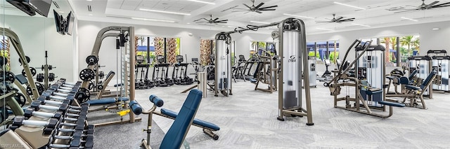 exercise room with ceiling fan