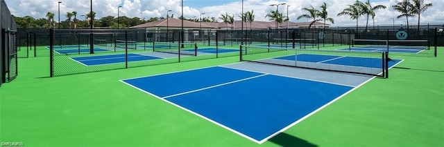 view of sport court featuring community basketball court and fence