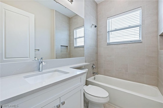 full bathroom featuring shower / bath combination, toilet, and vanity