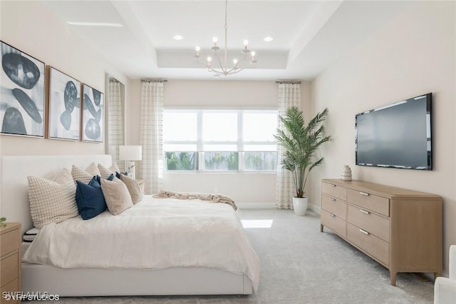 bedroom featuring recessed lighting, a notable chandelier, light colored carpet, baseboards, and a tray ceiling