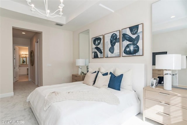 bedroom with visible vents, an inviting chandelier, light carpet, connected bathroom, and baseboards