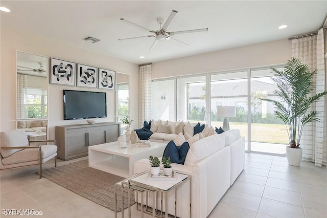 living room featuring ceiling fan and light tile patterned flooring