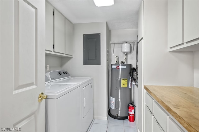 washroom with water heater, cabinets, separate washer and dryer, and light tile floors