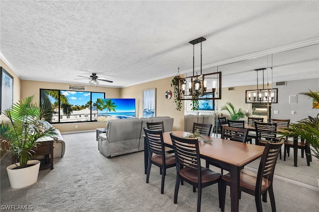 dining room with plenty of natural light, carpet flooring, a textured ceiling, and ceiling fan with notable chandelier